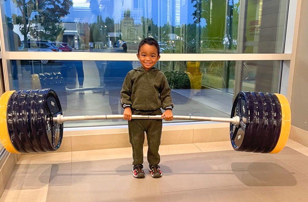 Child holding a barbell